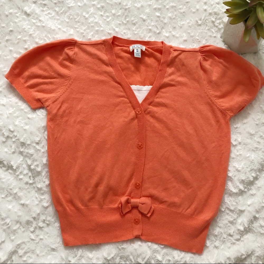 The children place cardigan size XL